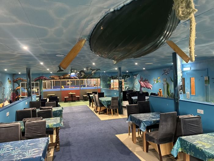 REEF underwater-themed family seating area